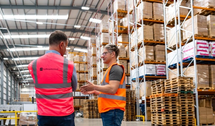 A conversation takes place in the warehouse