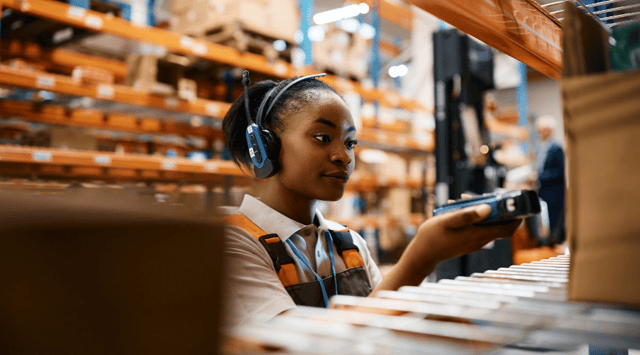 Woman scanning products in the warehouse