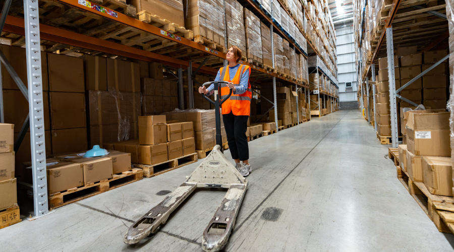 A fulfilmentcrowd employee with a forklift in the warehouse