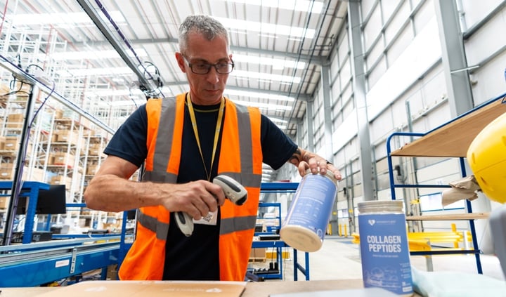 A fulfilmentcrowd worker scanning items in the warehouse